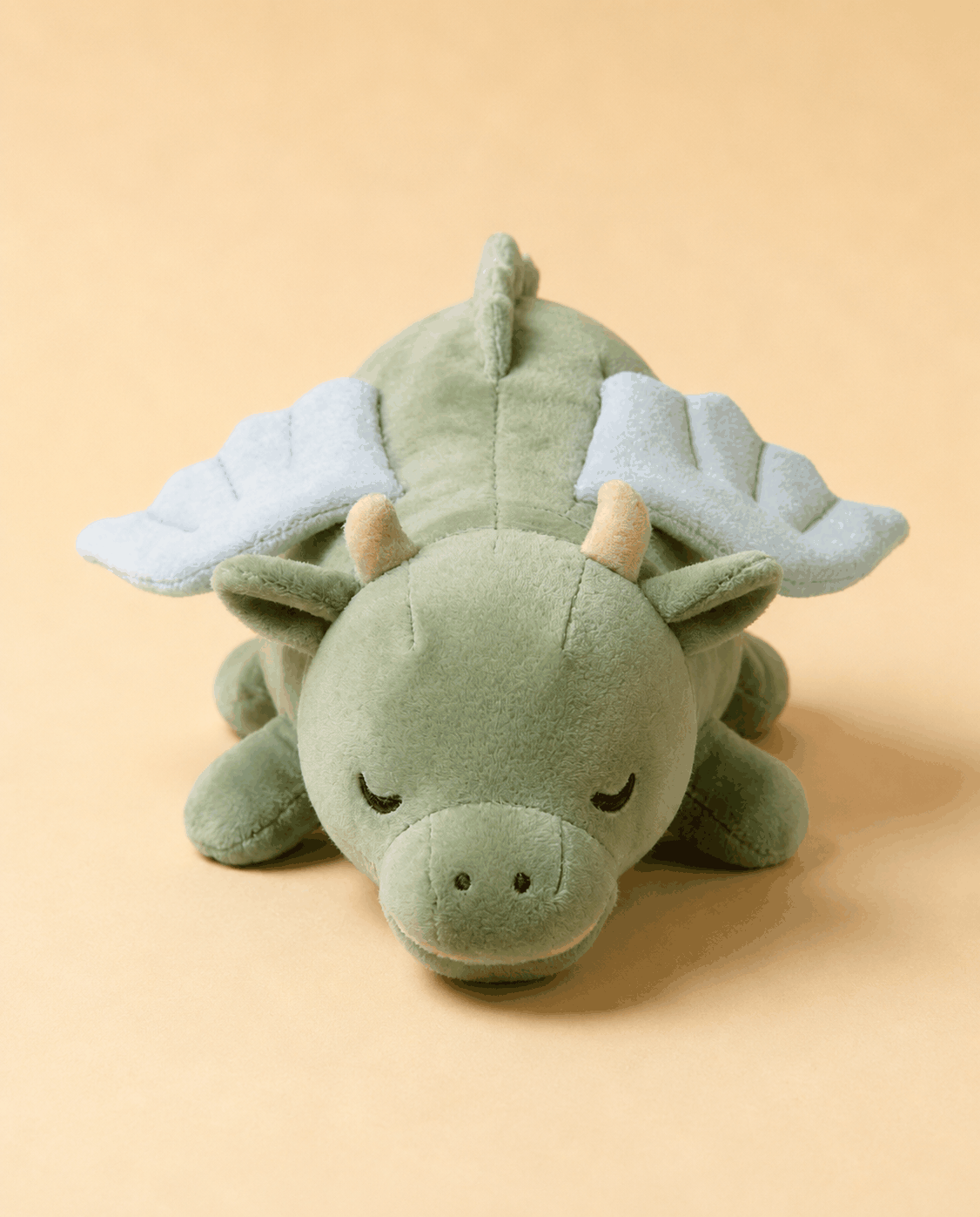 CalmHeart™ Dragón, peluche con latido para cachorros de Mimovia, vista frontal sobre fondo neutro
