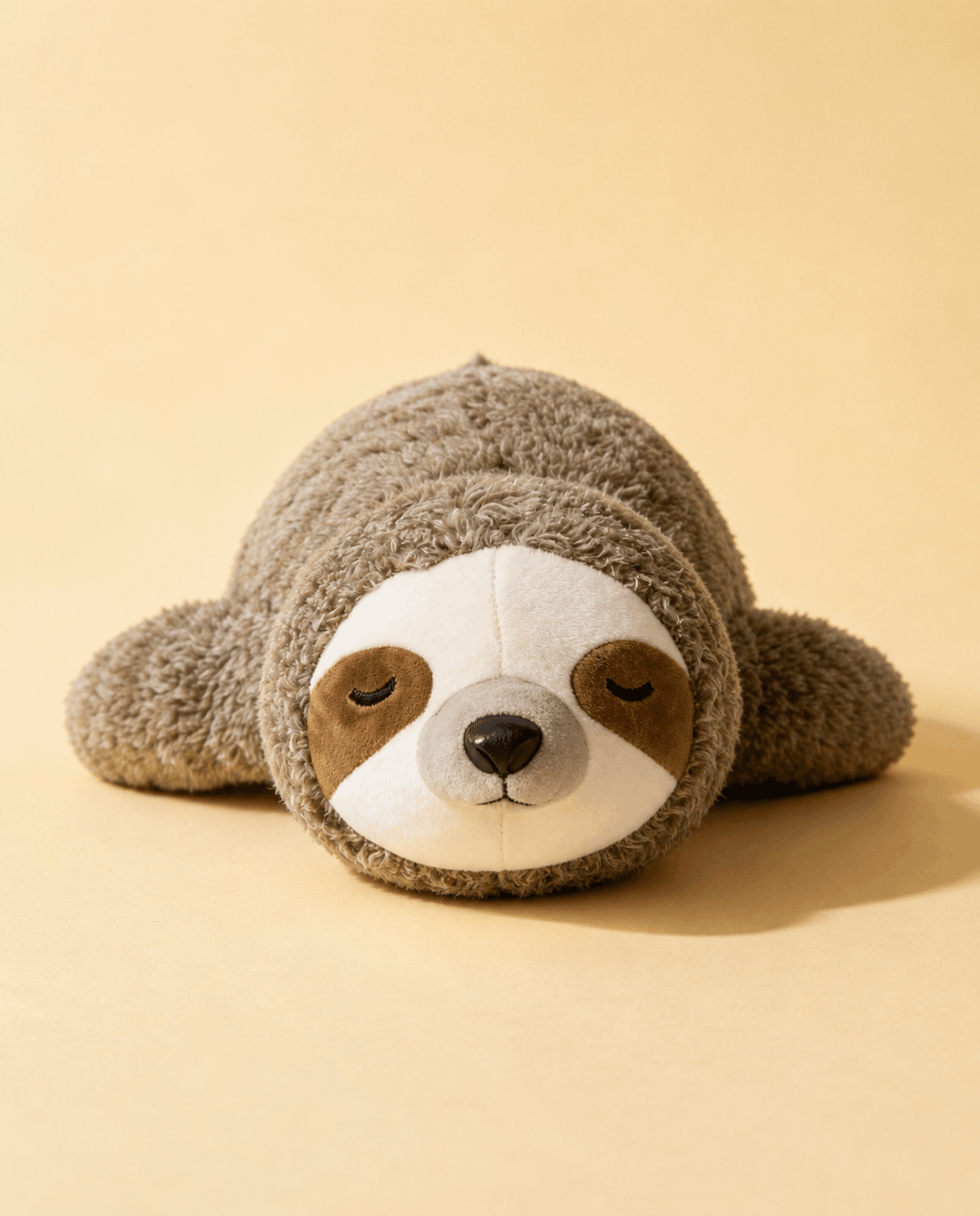 CalmHeart™ Perezoso, peluche con latido para perros de Mimovia, vista frontal sobre fondo neutro